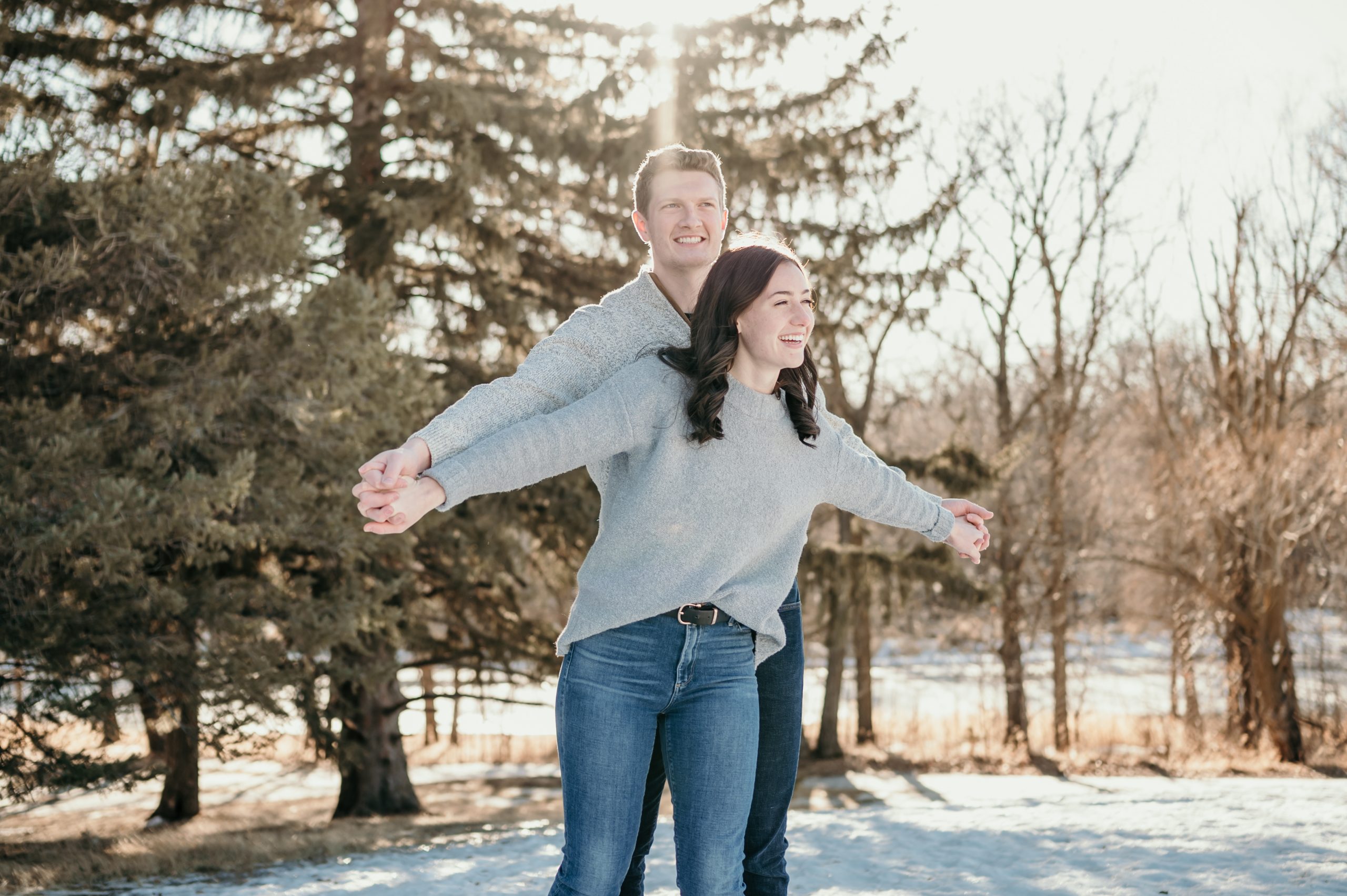 Airplane hands pose during an engagement photo session